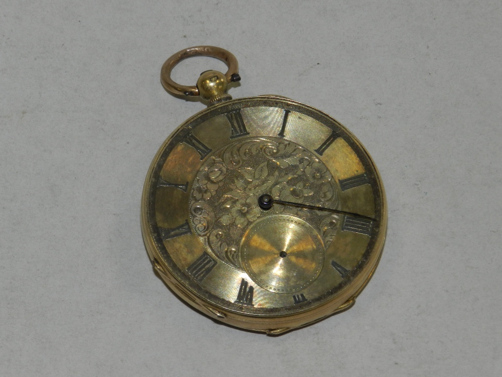 A yellow metal open faced fob watch the case stamped 18k, lacking glazing and one of the hands.