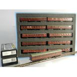 Ten N Gauge unboxed coaches by Lima in clear presentation case with foam insert in suburban maroon