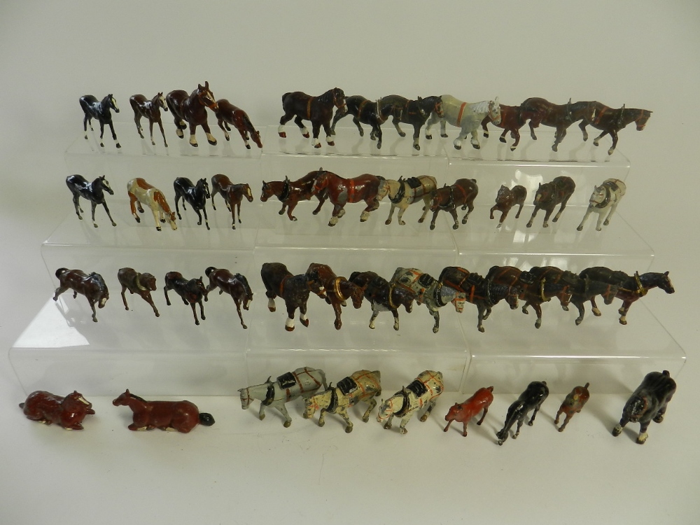 A group of 41 lead figures of horses in various poses and types by Britains and other manufacturers