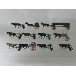 A group of 11 pre and post war lead farm horse drawn implements to include 7 rollers, 2 rakes,