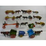 Twelve horse drawn carts and wagons by Britains and other makers,