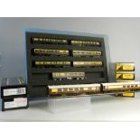 Seven N Gauge unboxed coaches by Lima in a clear presentation case with foam insert in G W brown