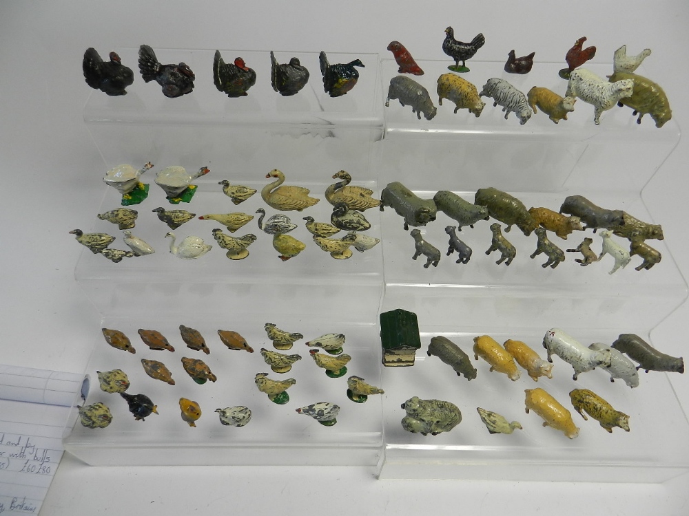 A large collection of small lead farm animals by Britains and others to include geese, hens, swans,