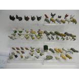 A large collection of small lead farm animals by Britains and others to include geese, hens, swans,