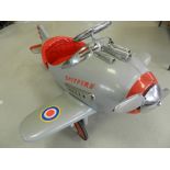 A pedal car in the form of a Spitfire aircraft,