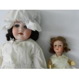 Two 1930's bisque headed dolls, the first with an overall length of 27cms by Wandie,