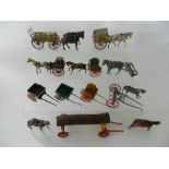 A group of 10 horse drawn carts and implements in lead by Britains, Charbens and others.