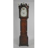 A late George III oak eight day longcase clock the13 inch arched enamel dial signed Rd.