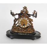 A late 19th century French spelter timepiece with seesaw regulator on a drum case and naturalistic