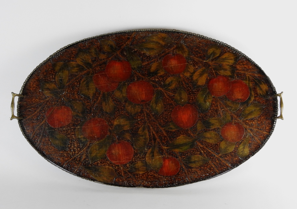 A late 19th century Arts and Crafts style oval two handled tea tray,