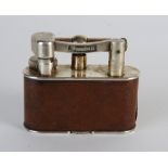 A Dunhill plated table lighter with leather covered body patent No.390107 Reg Design No.