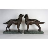 Two mid-brown patinated bronze sculptures of Irish Red Setters, second quarter 20th century,