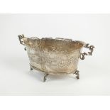 A Dutch silver two handled bowl, of oval form with embossed figural scenes to the body,