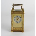 An early 20th century French gilt brass carriage timepiece the 1.