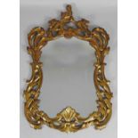 An 18th century style giltwood upright wall mirror of Rococo design,