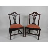 A set of six George III country Hepplewhite mahogany dining chairs each with a arched top rail