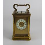 An early 20th century French gilt brass carriage clock the 2 inch diameter chapter ring of Arabic