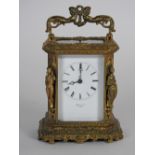 A French cast gilt brass carriage clock with push button repeat, retailed by Henry & Co, Paris,