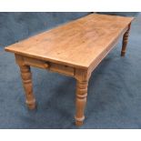 A 20th century waxed pine farmhouse table of rectangular form with four plank cleated top on four