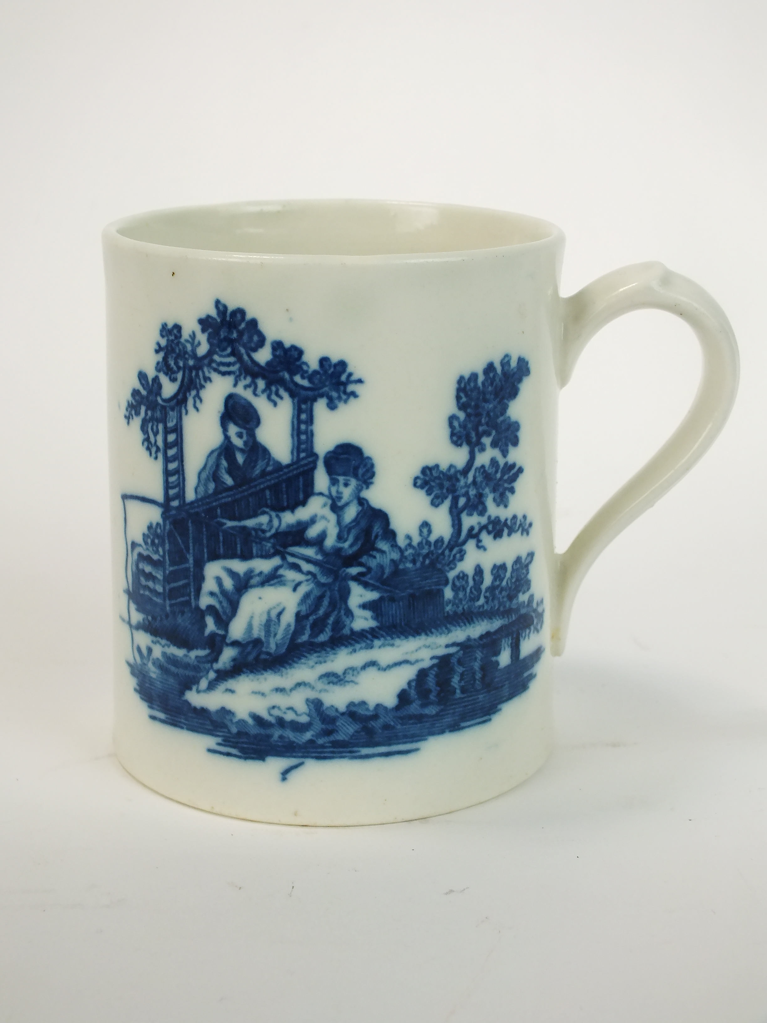 A Caughley mug, circa 1785, transfer-printed in underglaze blue with the La Peche pattern, S mark,