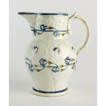 A Prattware jug of cabbage leaf form, painted in blue, green and ochre with two bands of foliage,