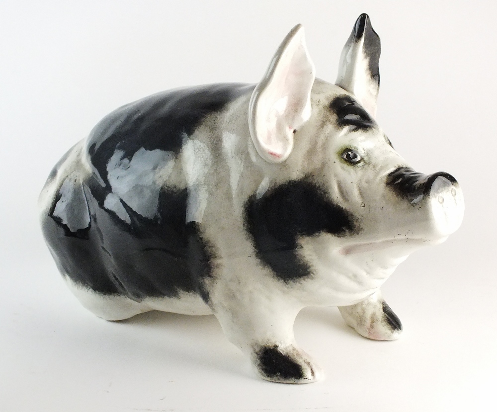 A large black and white pig retailed by T.Goode and Co, circa 1900, perhaps Wemyss but unmarked, 28.