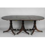 A 20th century mahogany Regency style three pillar dining table,