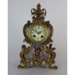An early 20th century French eight day champleve enamel Louis XV style mantel clock the 3 inch