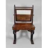 An early 19th century Dutch mahogany and marquetry dressing table with swing mirror plate and