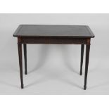 A 19th century mahogany writing table the leather inset top with rounded corners and crossbanded