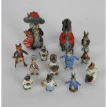 A group of early 20th century cold painted bronze miniature figures based on characters by Beatrix