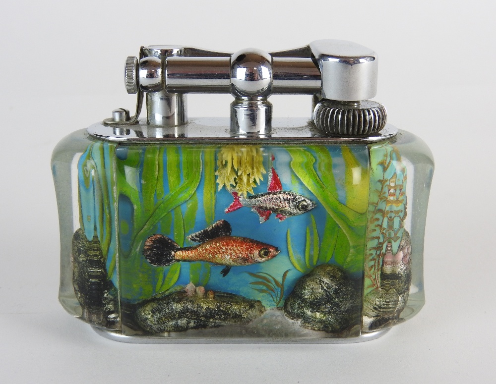 A Dunhill & 'Aquarium' table lighter, circa 1955 designed with fish plants and rocks,