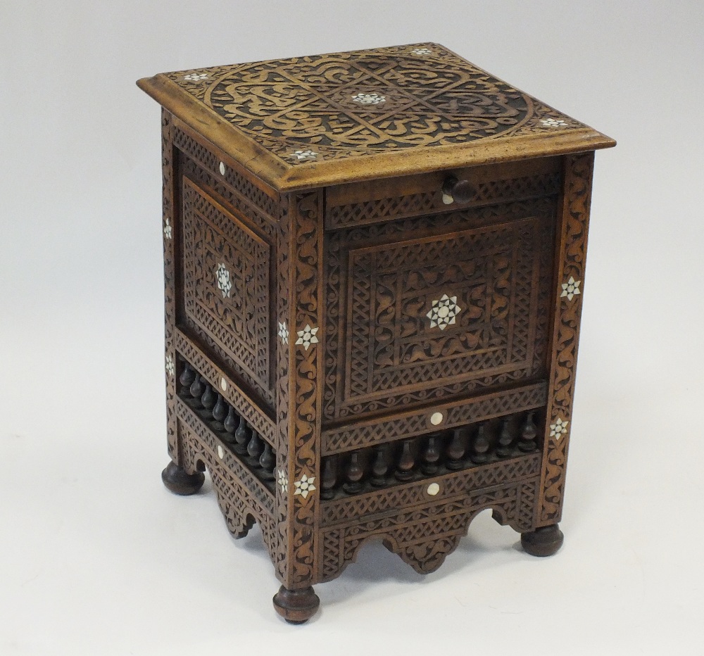 An early 20th Damascus style carved hardwood and mother of pearl inlaid coal box of square form