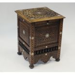 An early 20th Damascus style carved hardwood and mother of pearl inlaid coal box of square form