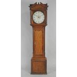 A late George III oak eight day longcase clock the14 inch circular dial sighed Thos.