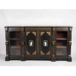 A mid Victorian Aesthetic style ebonised and walnut banded low bookcase with gilt metal mounts the