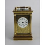 A 20th century gilt brass repeating carriage clock retailed by Nathan & Co Birmingham with 2.