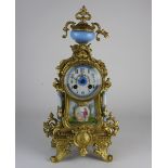 A Louis XVI style French mantel clock, the 3 inch porcelain dial with ring of Arabic numerals,