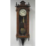 A late 19th century figured walnut Vienna style wall clock, the 7.