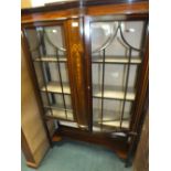 An Edwardian inlaid mahogany glazed display cabinet with astragal glazed doors raised on square