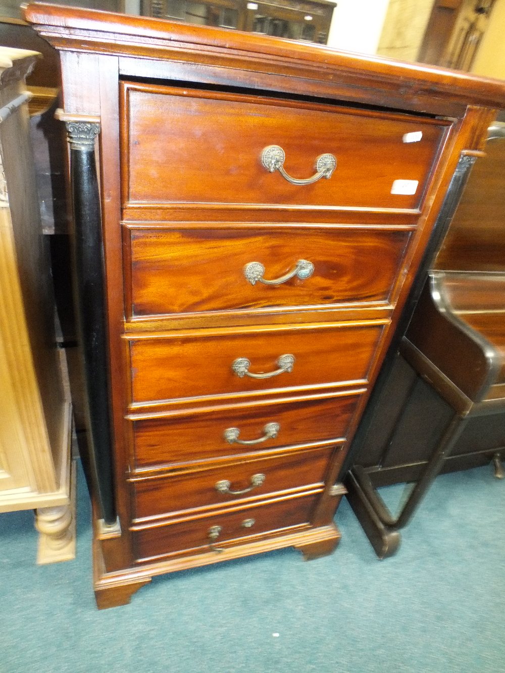 A reproduction mahogany tall boy chest of drawers,