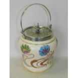 A Carlton Ware biscuit barrel with white metal cover and swing handle