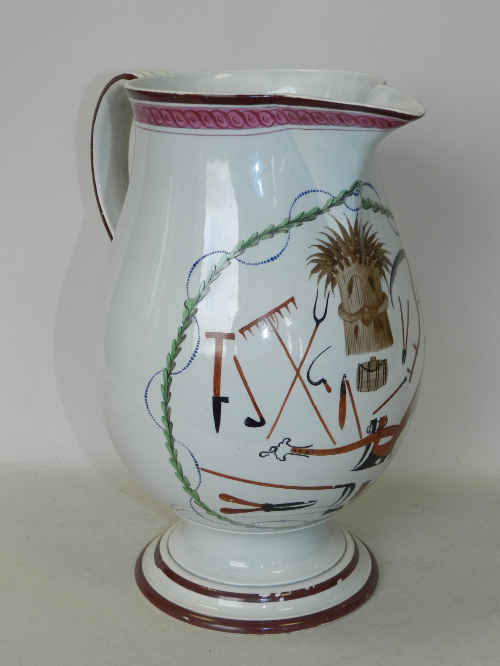 A late 18th/early 19th century pearlware 'Farmers Arms' baluster jug,