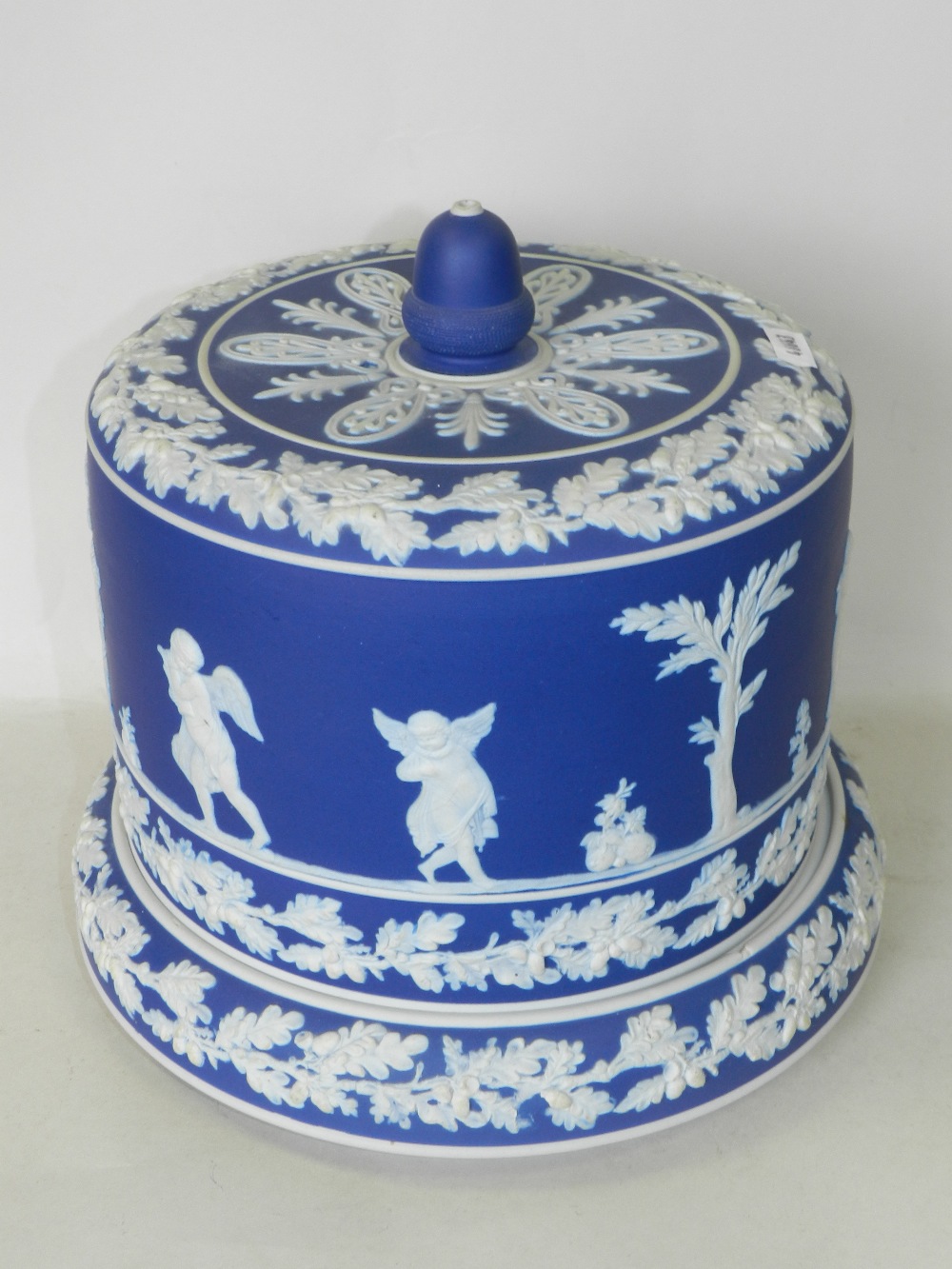 A large Victorian dark blue jasper cameo ware cheese dish and cover, perhaps Dudson,