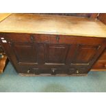 A mid 18th century oak mule chest with three fielded panels over one long drawer (reduced height).