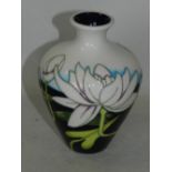 A small contemporary Moorcroft vase tubelined with flowers contained within original box