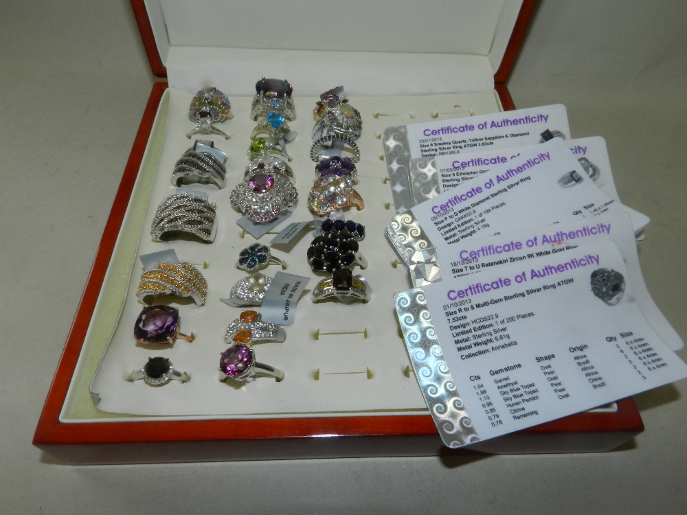 A collection of 25 silver and stone set dress rings, to include an ametrine set ring,