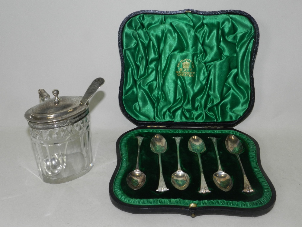 A cased set of six silver teaspoons together with a silver mounted mustard pot and spoon.