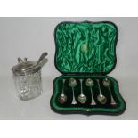 A cased set of six silver teaspoons together with a silver mounted mustard pot and spoon.