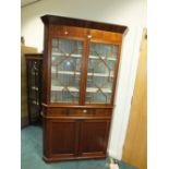 A 19th century mahogany straight front floor standing full height corner display cabinet.